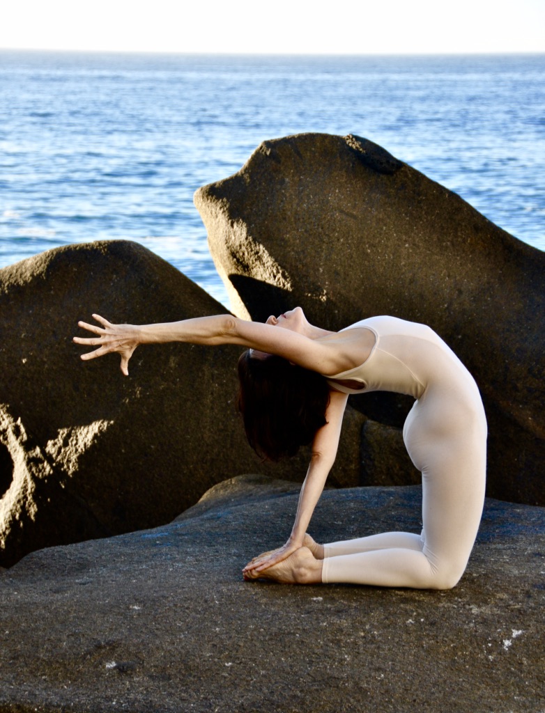 woman
                  doing backbend yoga